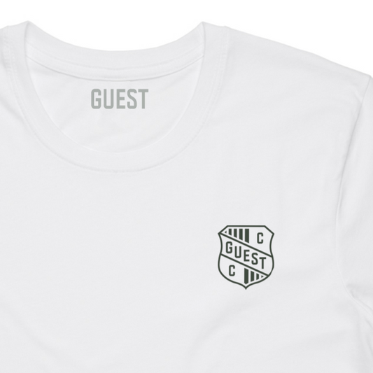 Close-up of White GUEST t-shirt with small crest logo on left chest