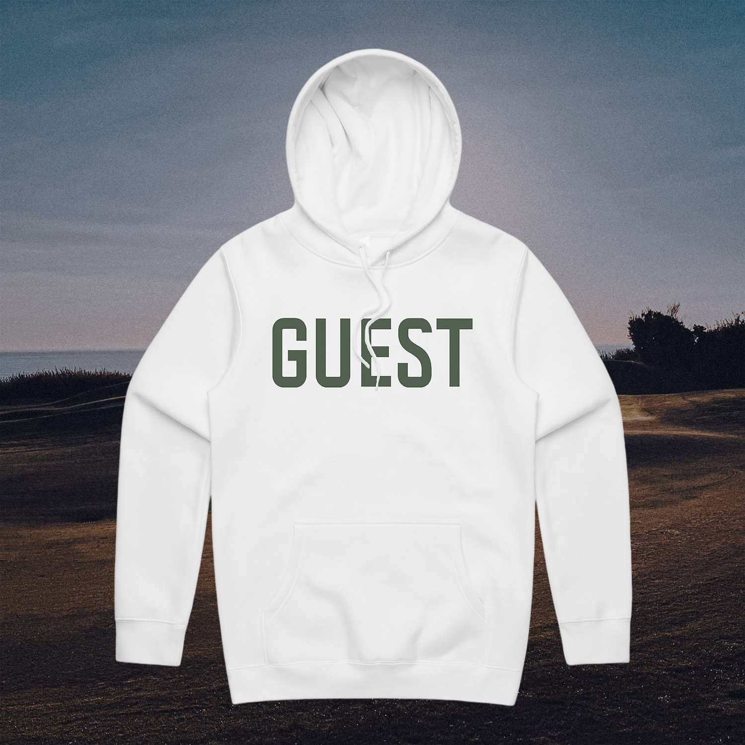 White hoodie with Guest logo displayed against a scenic golf course backdrop at sunset.