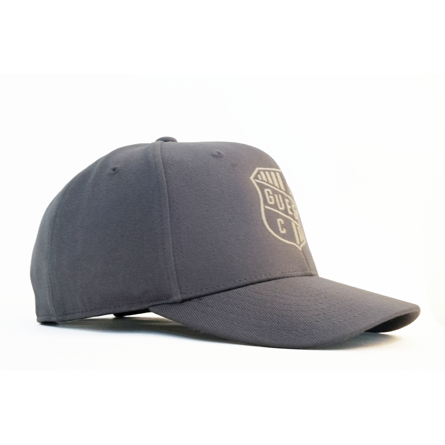 Side angle of grey Country Club GUEST golf hat featuring embroidered crest