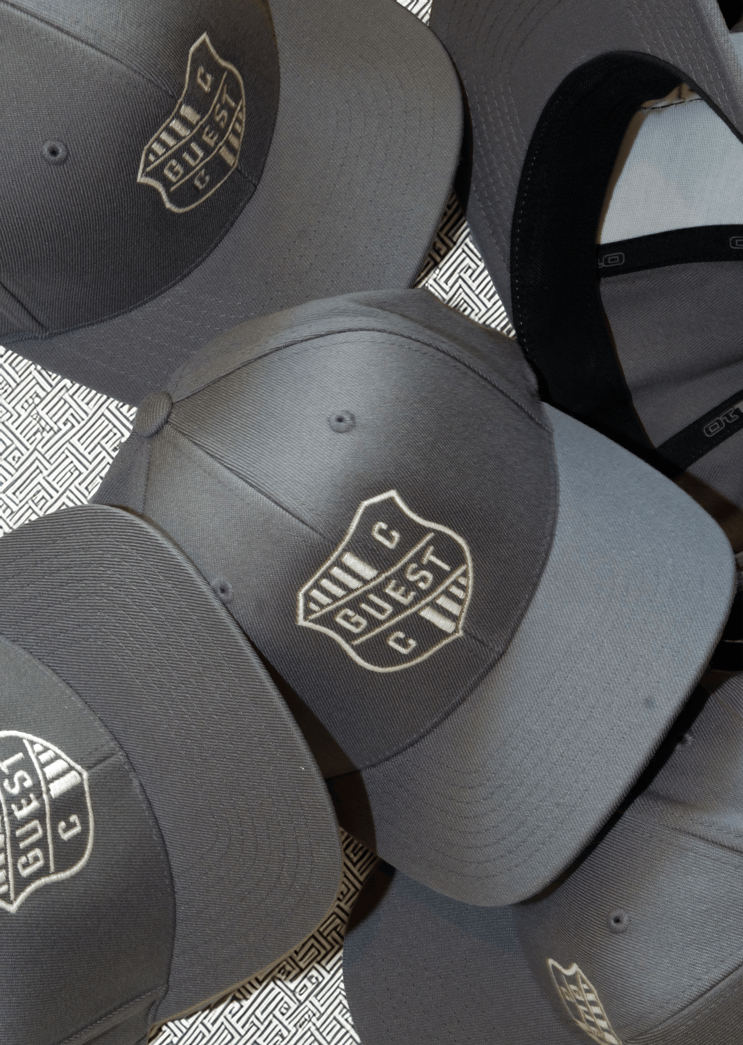 Grey Country Club Guest hats with embroidered crest logo
