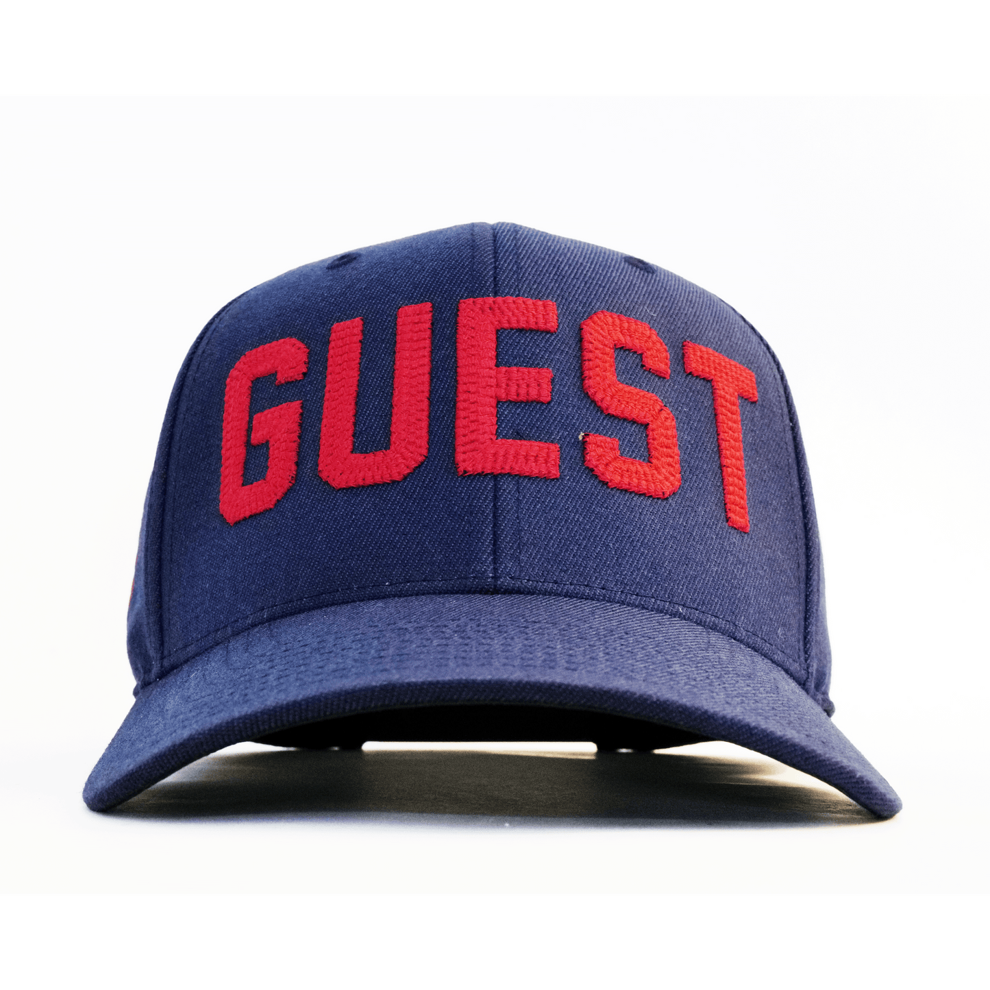 Front view of a navy Country Club GUEST hat with bold red embroidered lettering